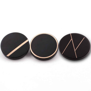Black metal shank coat button, round face with gold-colored stripes
