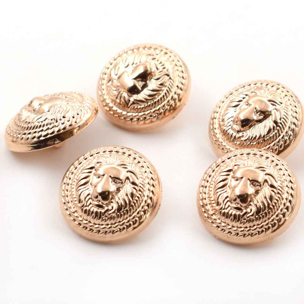 Set of antique gold lion head shank buttons with textured raised border