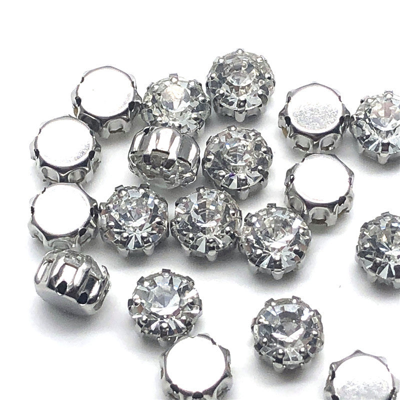 Set of clear round rhinestone buttons with 8-claw flat back prongs and silver edges