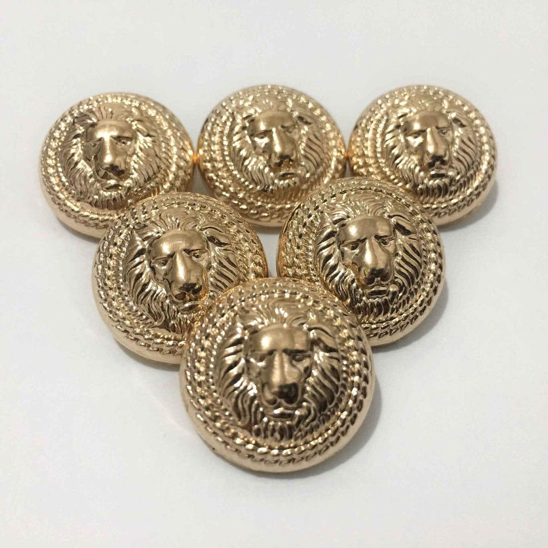Gold lion head metal shank button set, round with ornate wreath detail