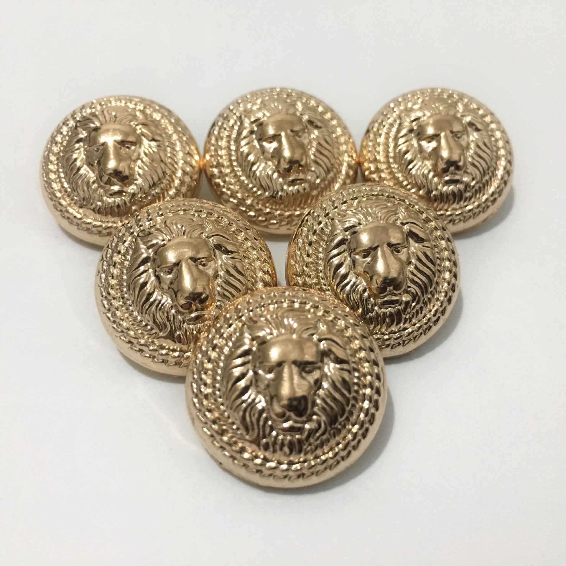 Gold lion head metal shank button set, round with ornate wreath detail