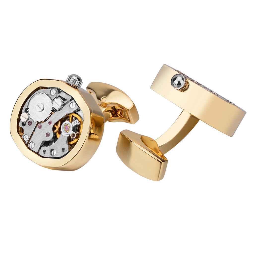 Gold mechanical watch movement cufflinks with round skeleton dial face and hinged backs
