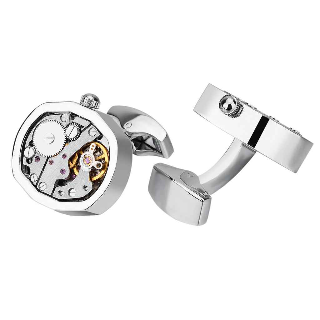 Gold mechanical watch movement cufflinks with round skeleton dial face and hinged backs