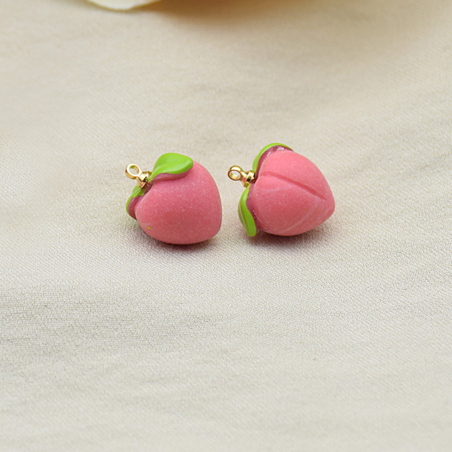 Pink 3D resin peach charms with green cap, gold loop