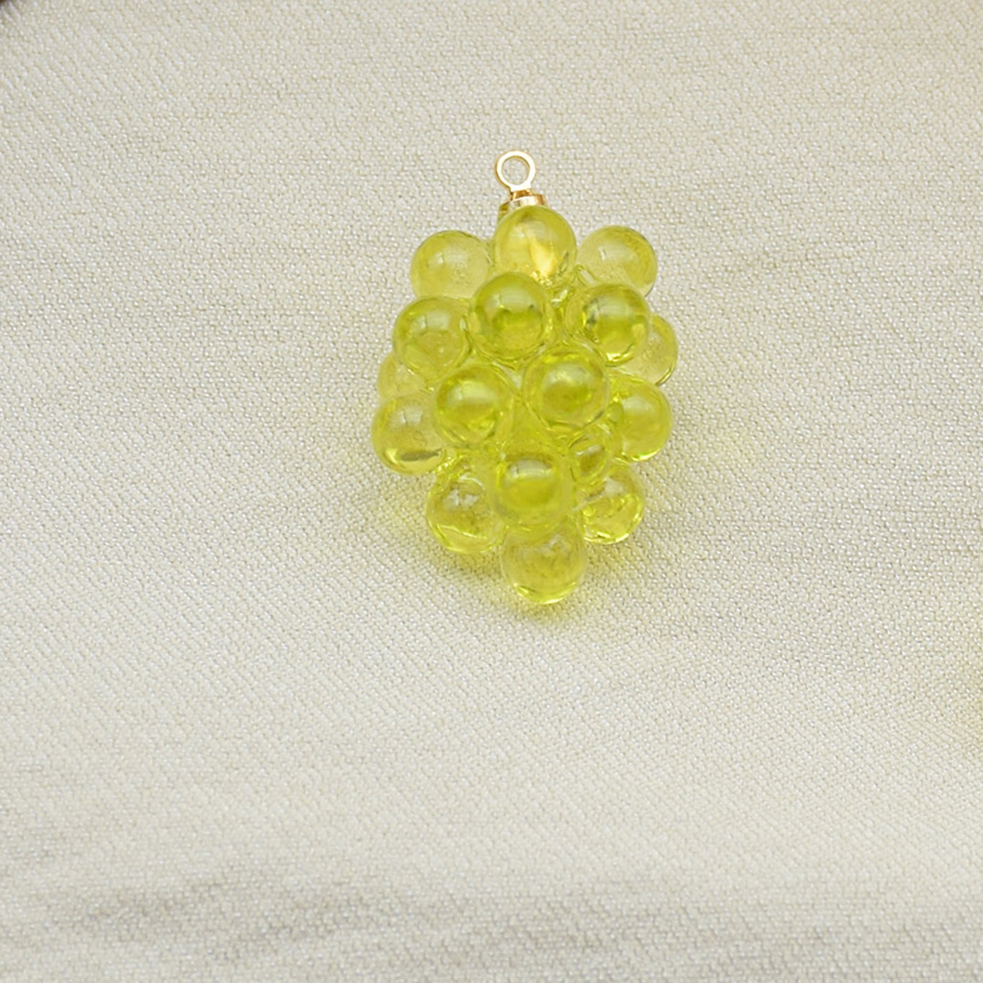 Milky yellow 3D resin grape charm pendant with gold loop and bubble-like grapes