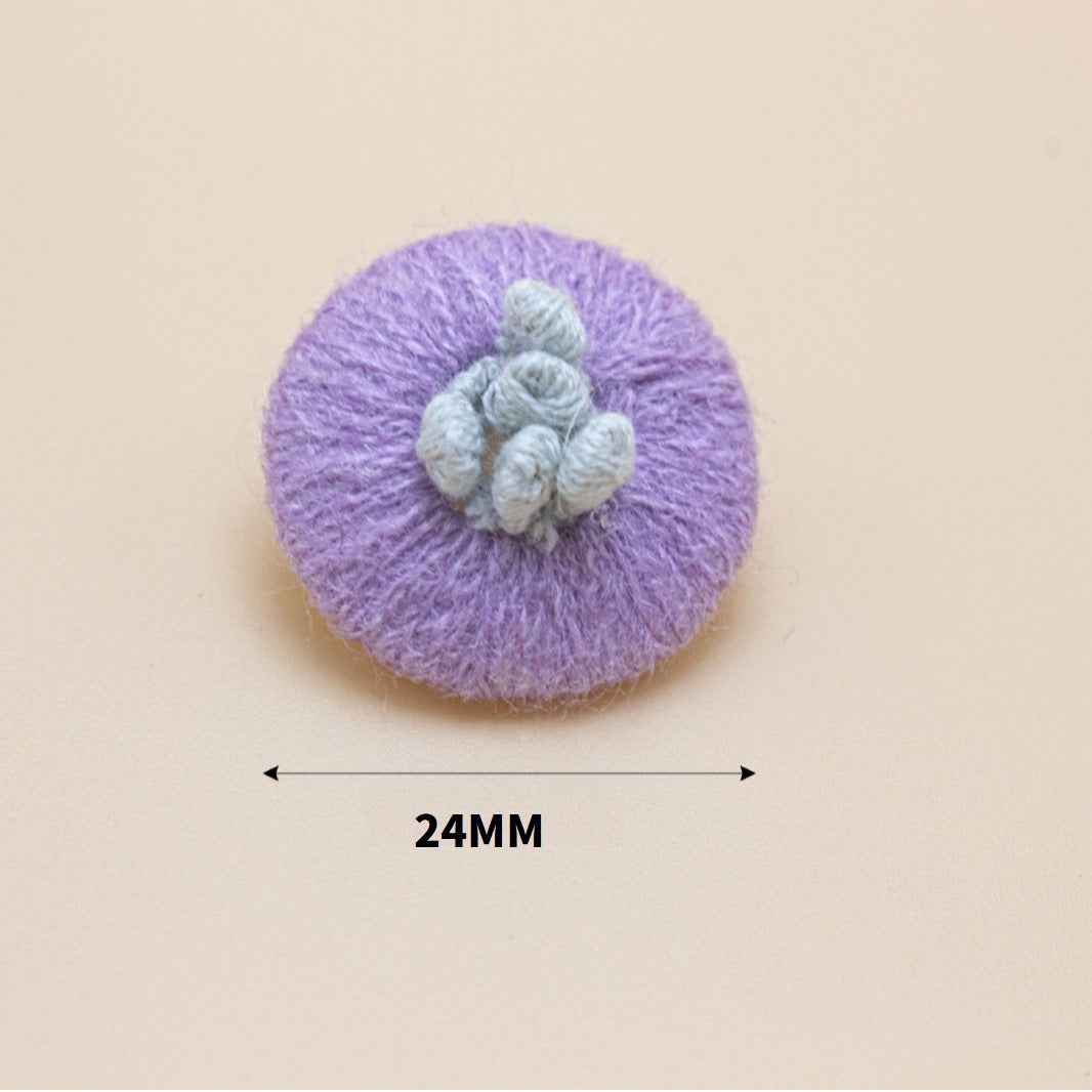 24mm knitted yarn button, purple round base with light blue flower detail