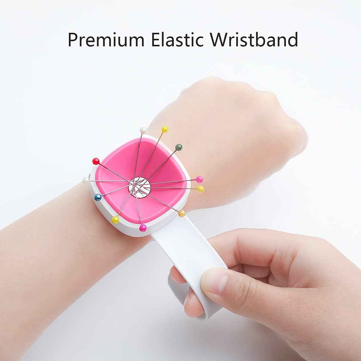 Magnetic wrist pin cushion worn on wrist with pink pad and sewing pins attached.