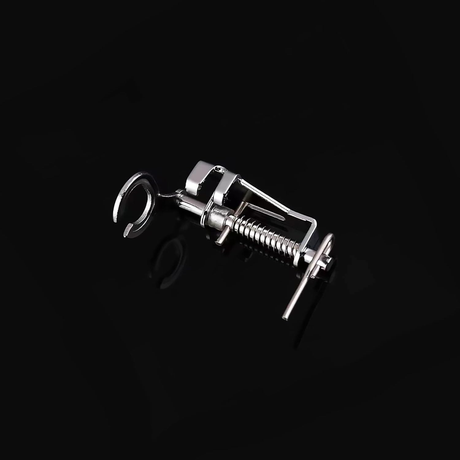 Open-toe embroidery presser foot with U-shaped cutout and silver metal frame