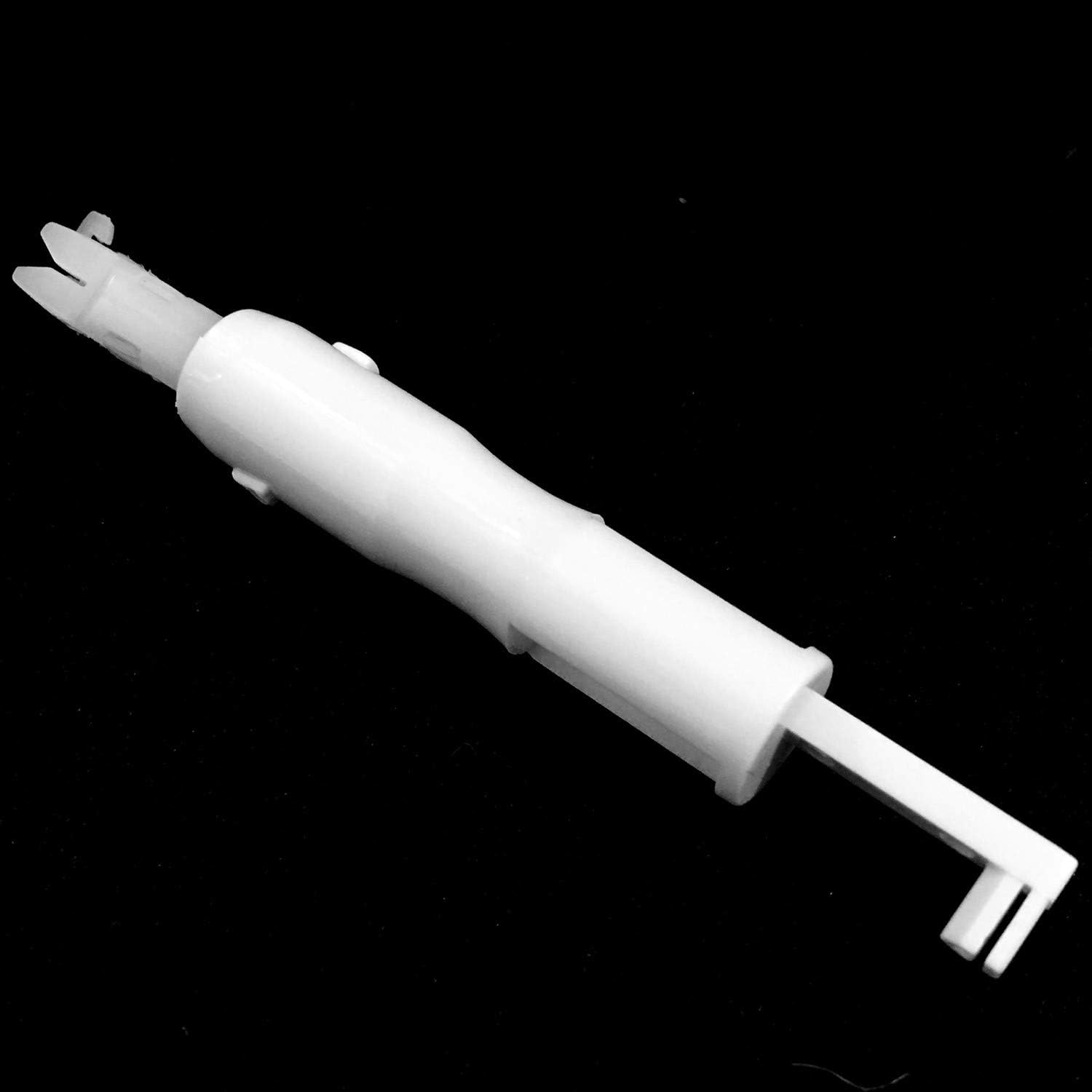 White automatic needle threader with forked end for guiding thread through needle eye.