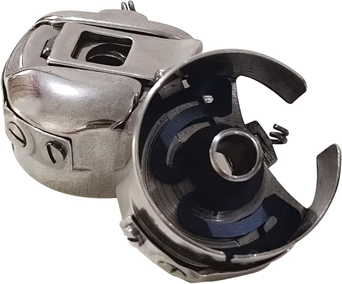 Angled view of metal bobbin case with central circular opening and internal parts