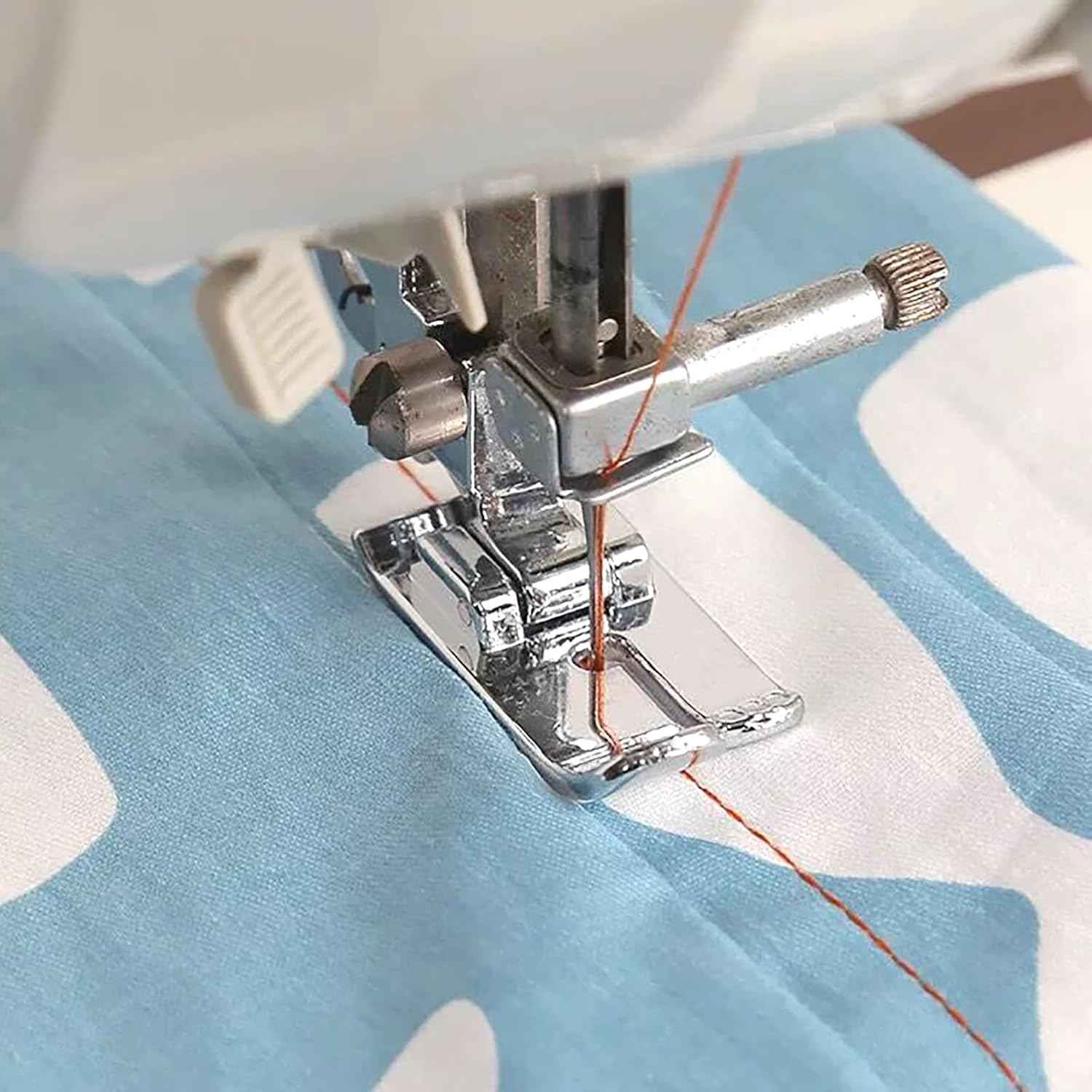 Straight stitch snap-on presser foot installed on sewing machine, stitching fabric