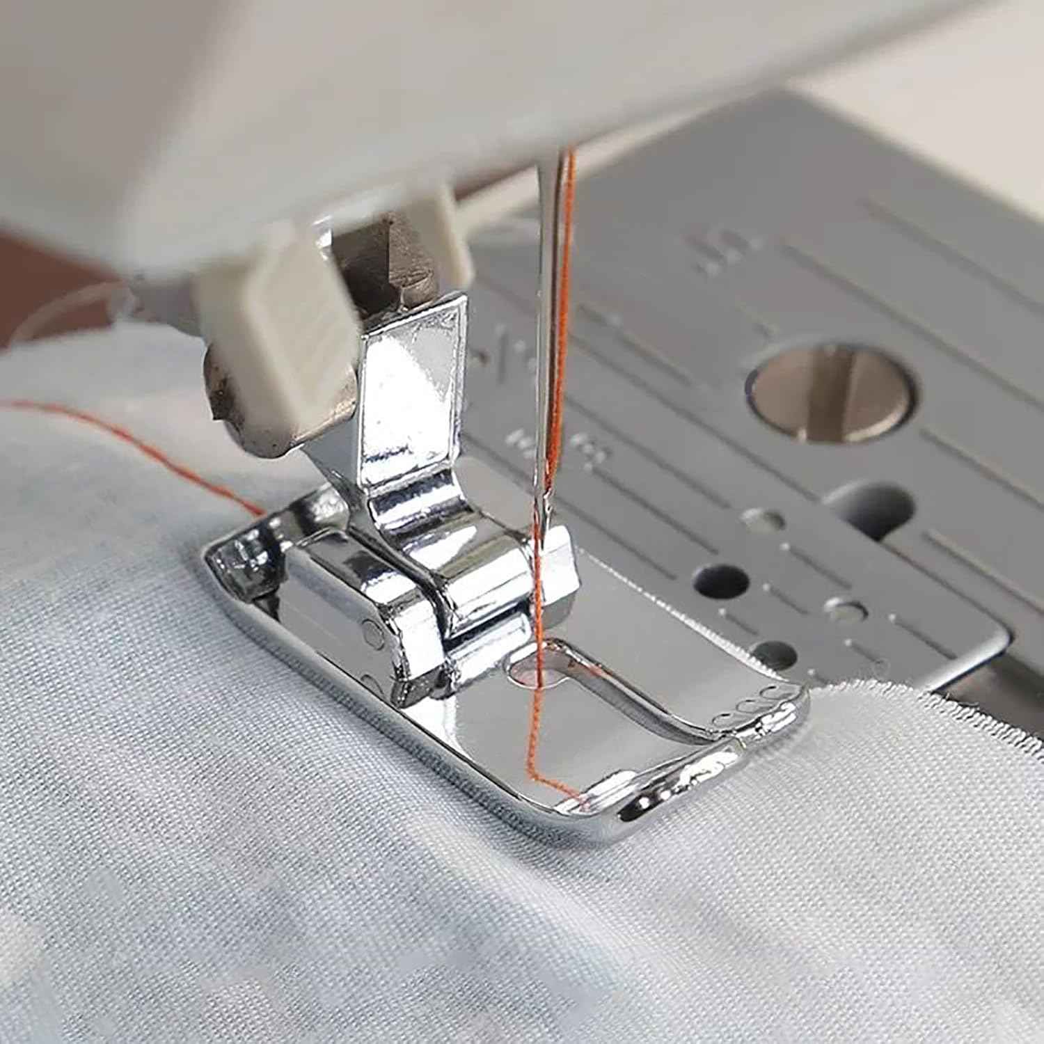 Snap-on presser foot guiding straight seam on fabric, with needle and thread visible
