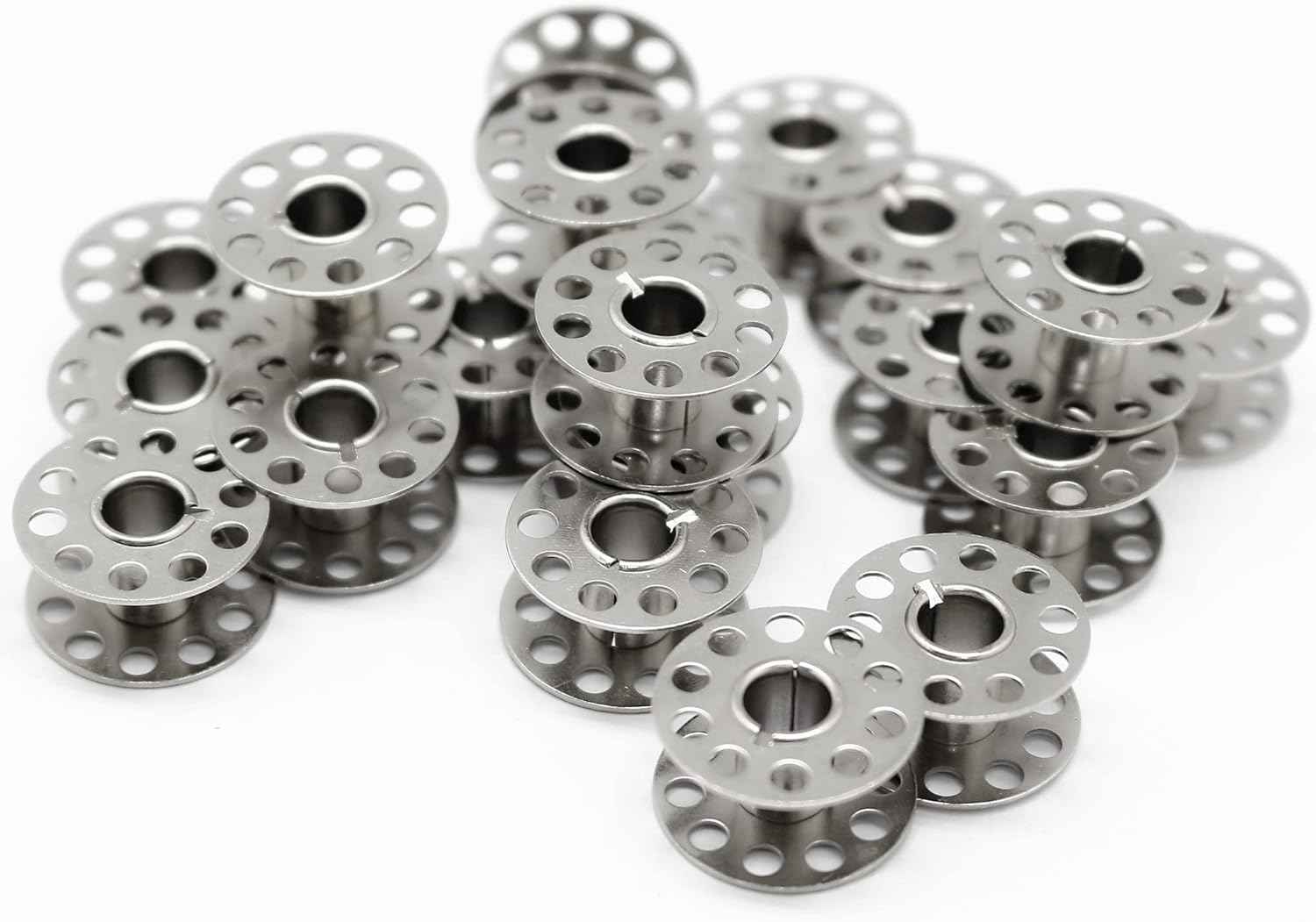 Set of metal bobbins, silver spools with perforated rims