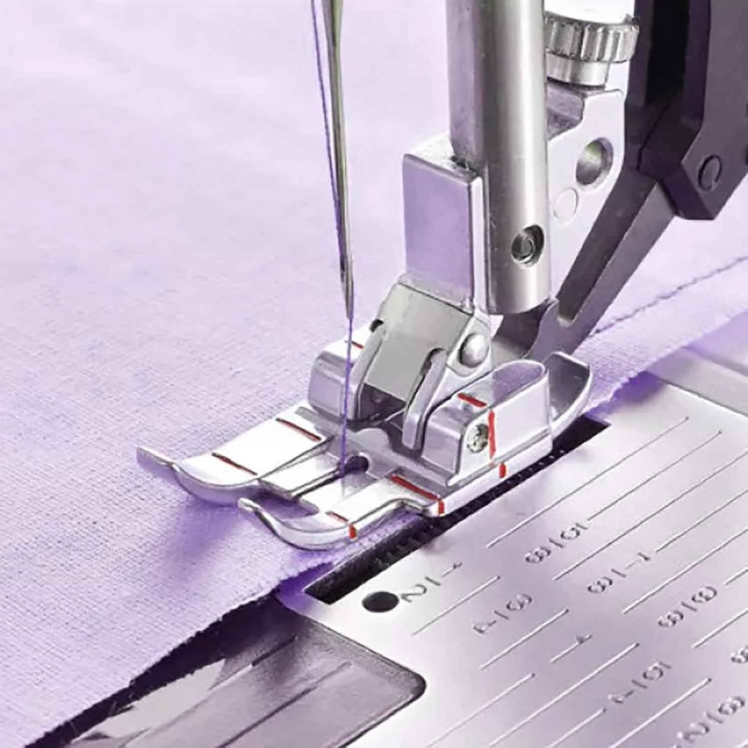 1/4" quilting foot attached to sewing machine, stitching guideline on fabric