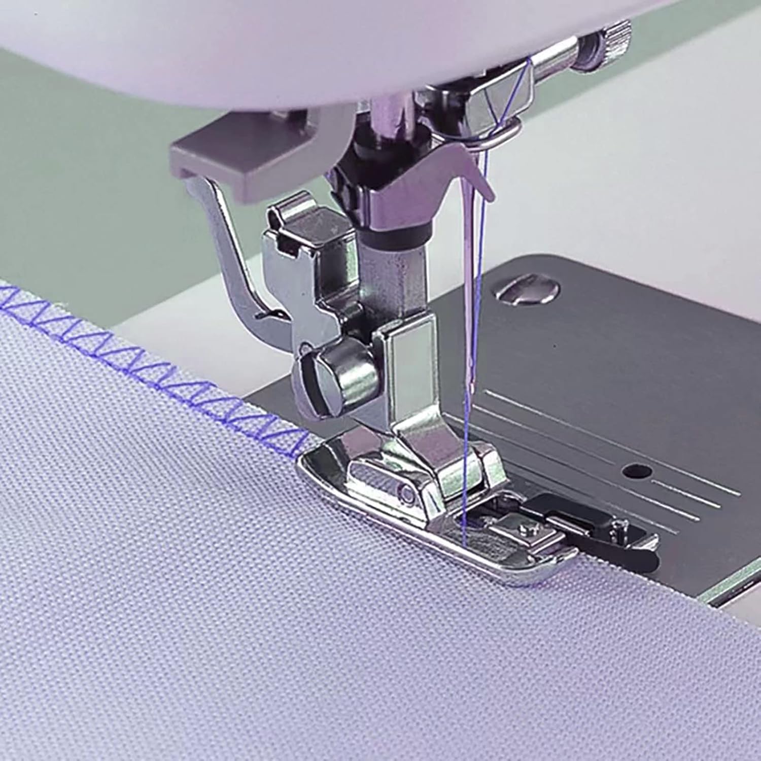 Overlock overcast presser foot on sewing machine, threading area and needle access visible