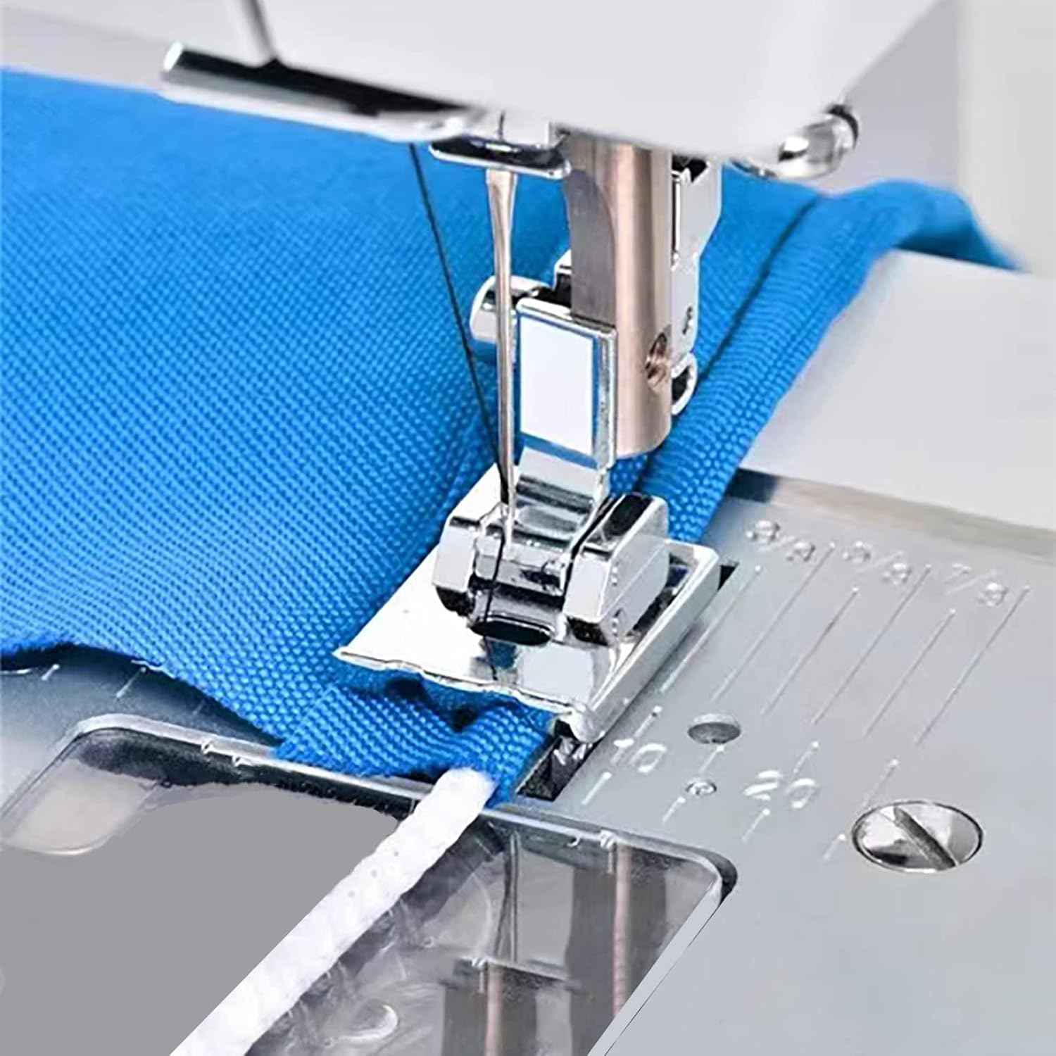 Piping presser foot on blue fabric, snap-on low-shank installed