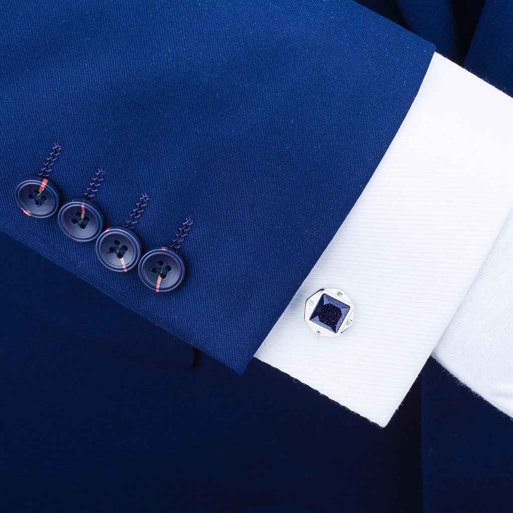 Silver-tone cufflinks with square blue sandstone center and small crystal accents
