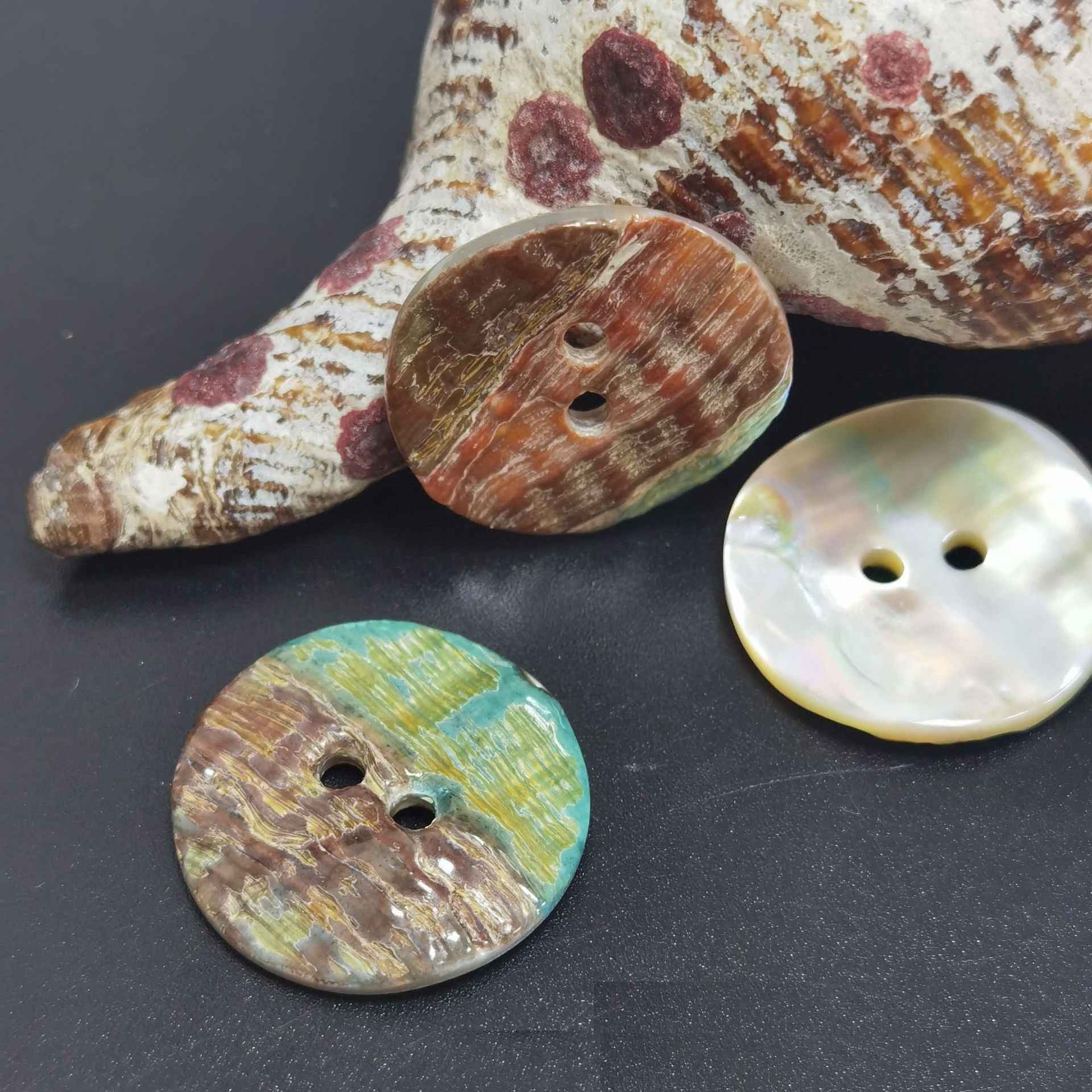Abalone shell 2-hole knitting buttons, round shape with iridescent white, brown, and green coloring