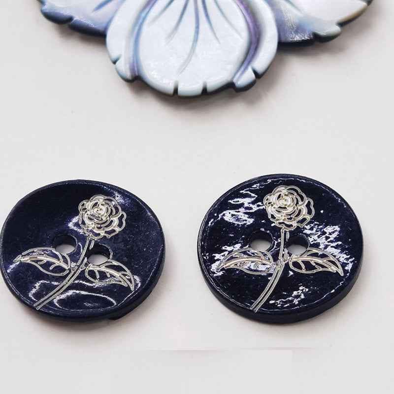 Black printed mother-of-pearl shell button with floral vine, two holes, 15mm