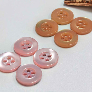 Orange-rosa Perlmuttknöpfe mit breitem Rand, 4 Löcher (100er Pack)