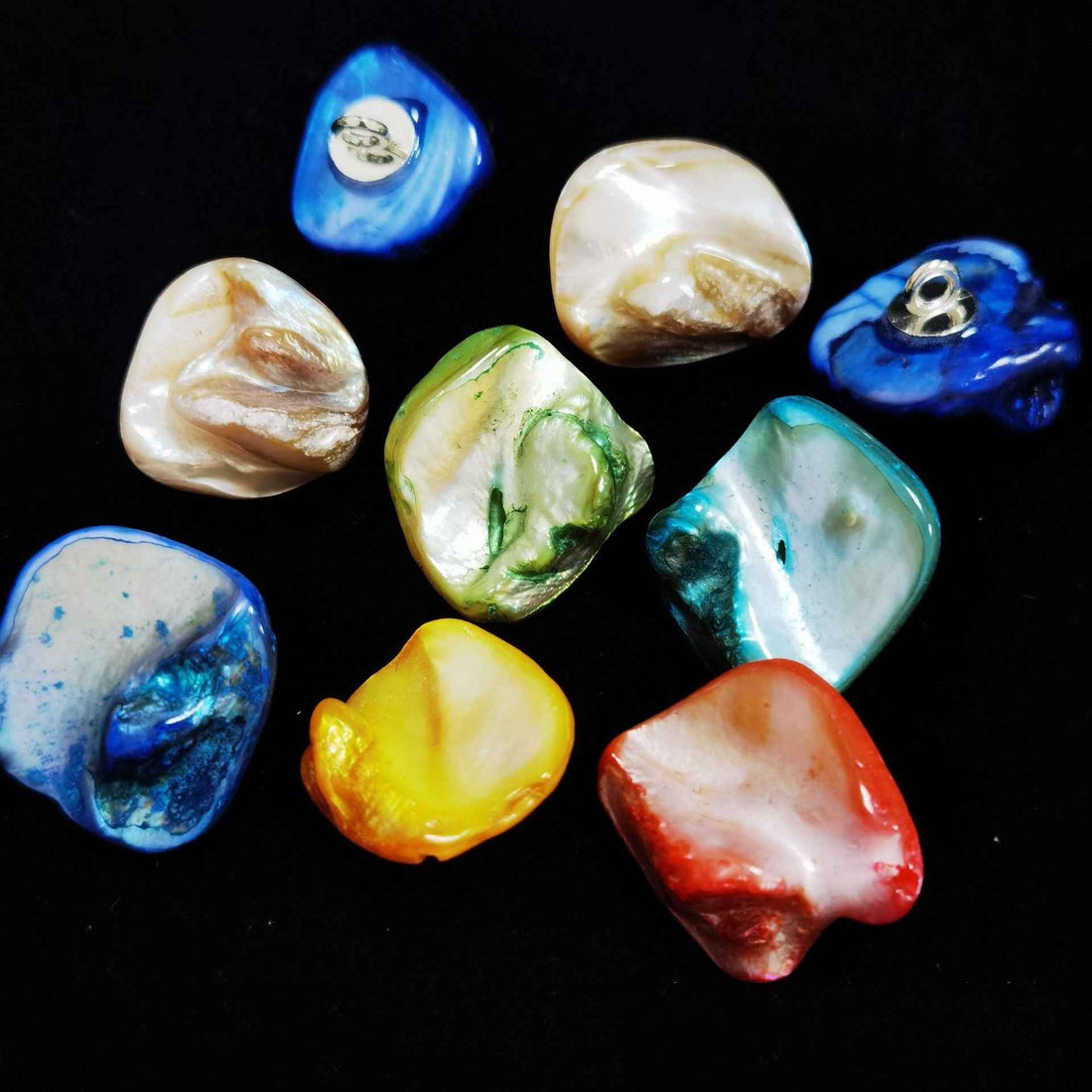 Irregular shell shank buttons, mixed blue/green/orange/white, metal loop shanks.