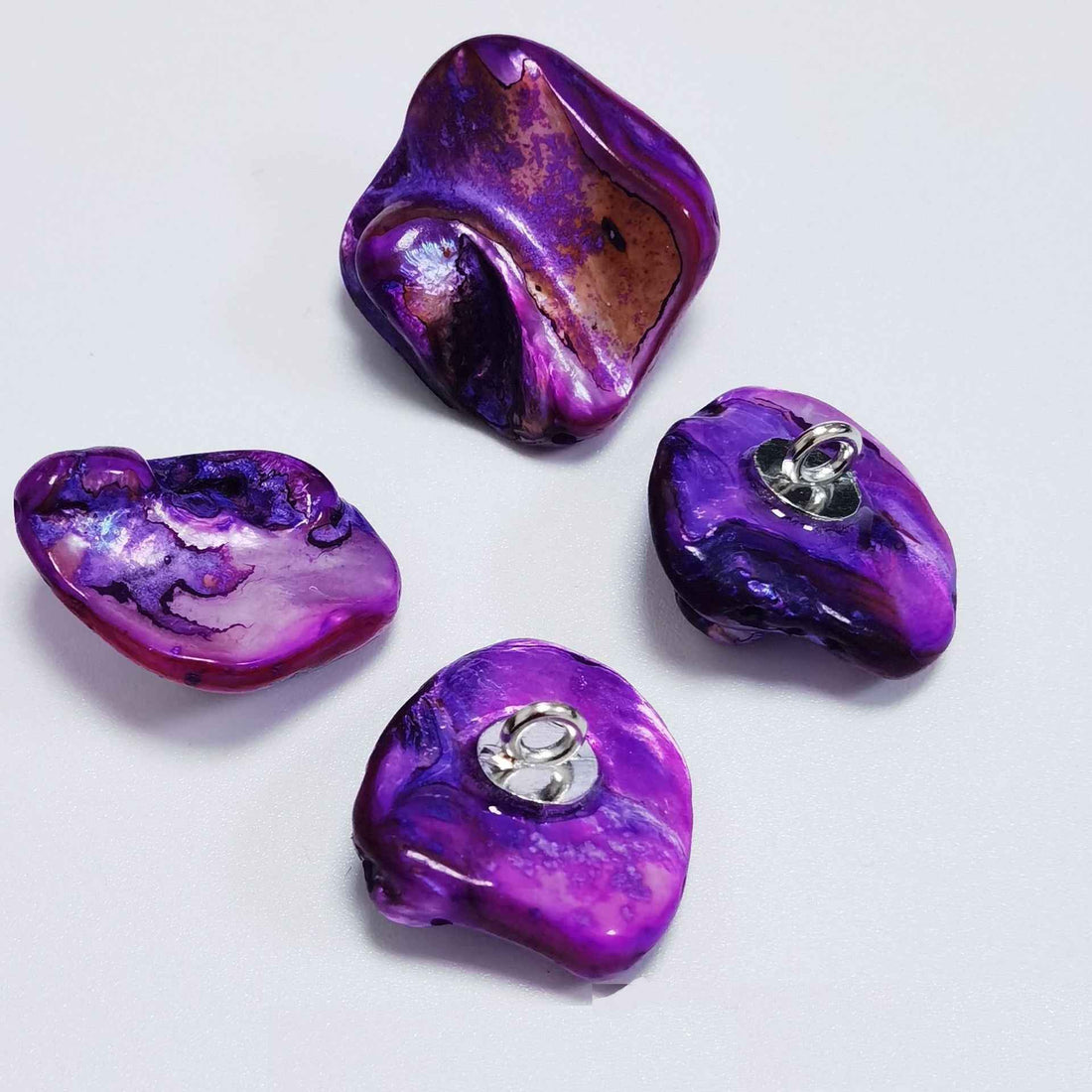 Irregular shell shank buttons, mixed blue/green/orange/white, metal loop shanks.