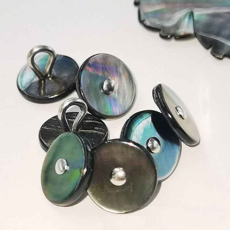 Black mother-of-pearl shell buttons with metal shanks; rainbow iridescent surface
