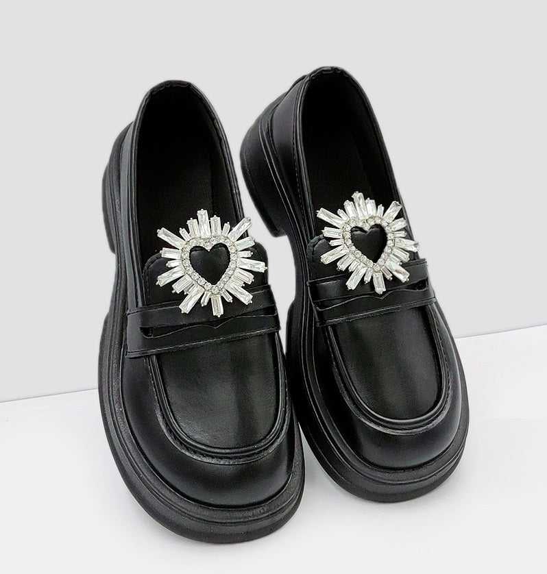 Black high heels with detachable rhinestone heart shoe buckles, starburst spikes