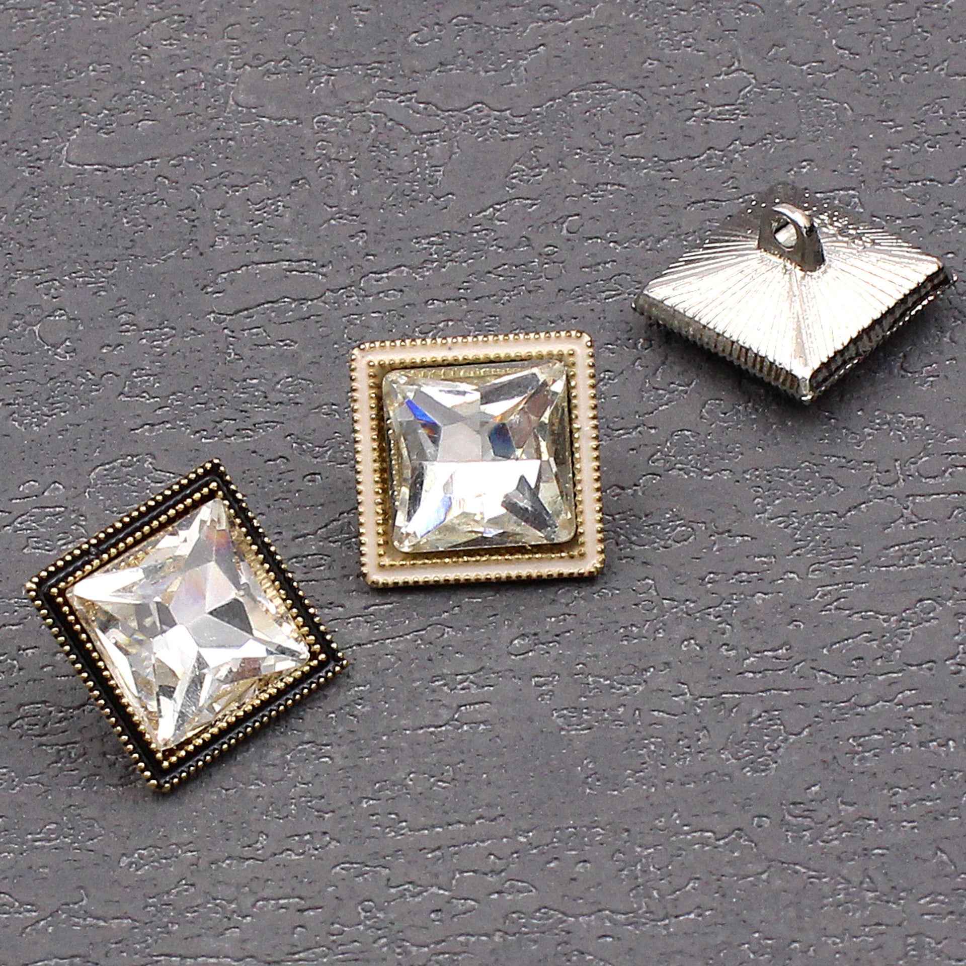 Square crystal shine glass button with clear star-cut crystal, gold bezel and dark border