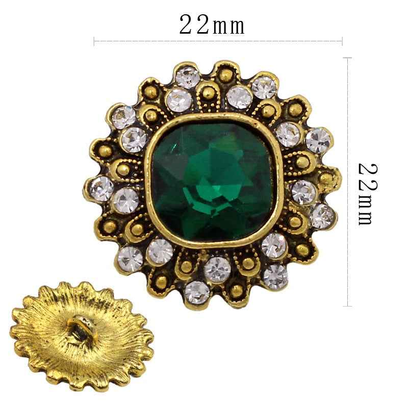 Antique gold oval shank button with pearl border and black center crystal