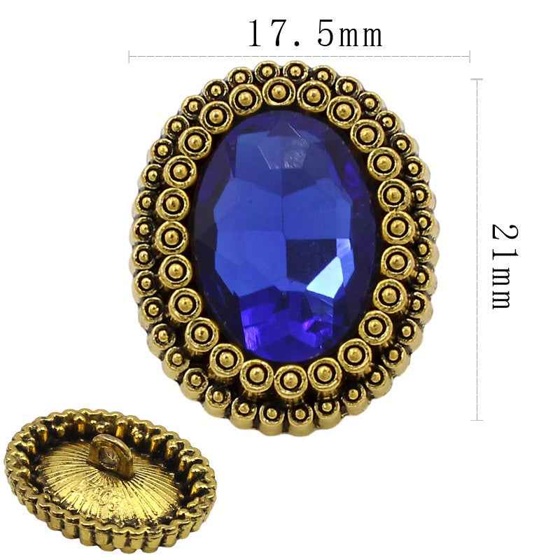 Goldfarbene ovale Strassknöpfe, blauer Stein; Rückseite mit Nadel; Größe 17,5 mm