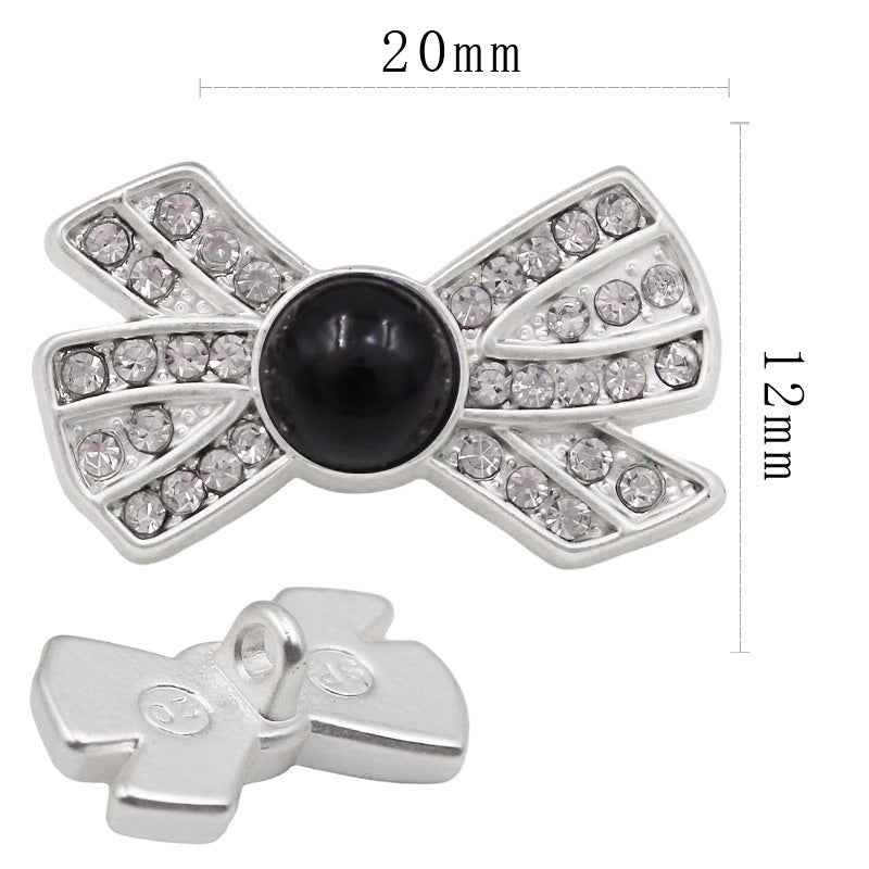 20x12mm bow-shaped rhinestone button, white pearl center, silver-tone setting