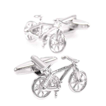 Polished steel bicycle-shaped cufflinks, front wheels and handlebars visible