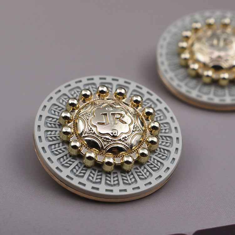 Round vintage metal shank button, gold center with white base and bead border