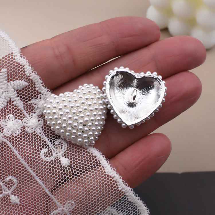 Heart-shaped faux pearl button on lace fabric, silver metal back and bead border