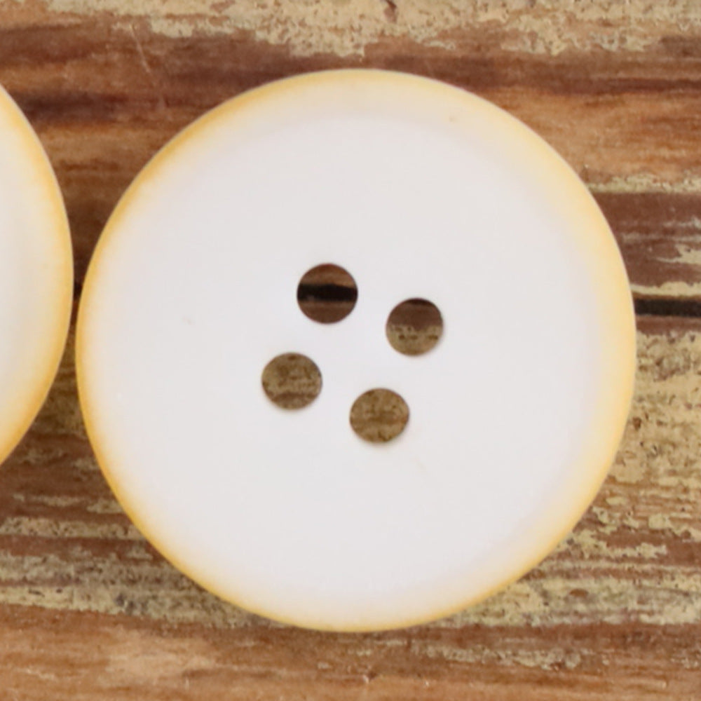 Yellow round 4-hole matte natural nut button with four dark holes