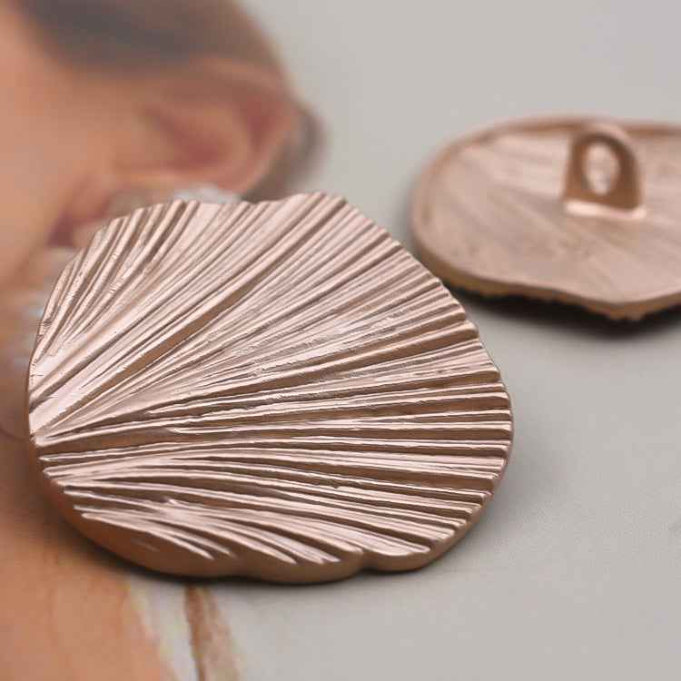 Gold leaf metal button, round face with engraved radial lines