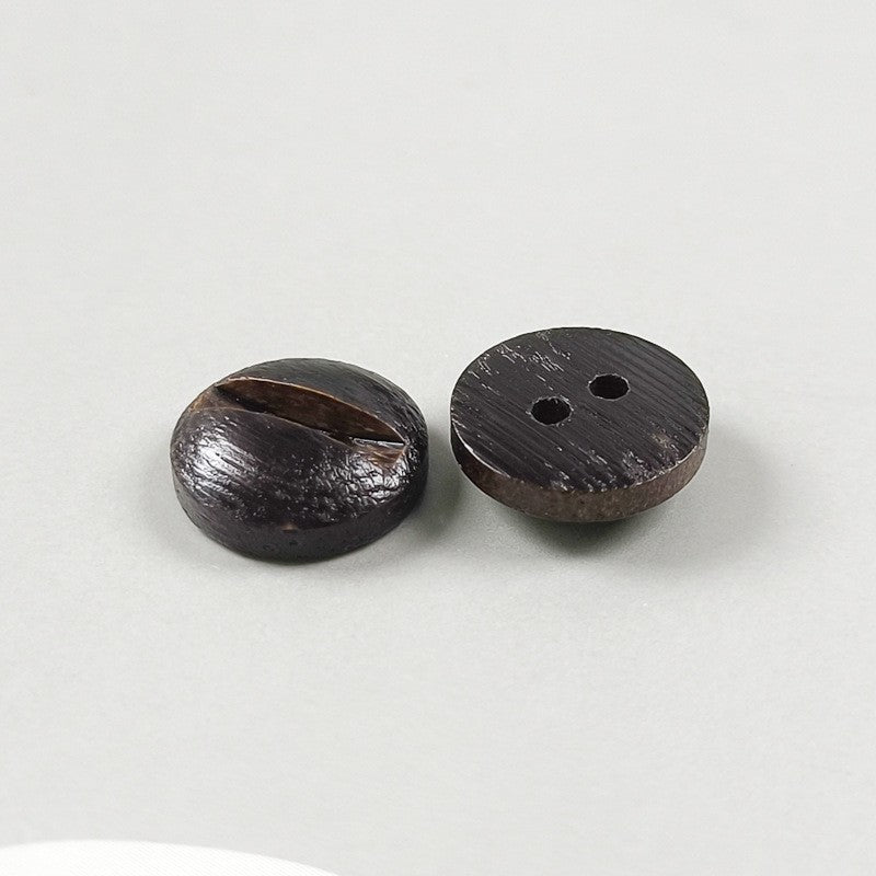 Two round 2-hole grooved wood buttons in dark brown, one front, one side