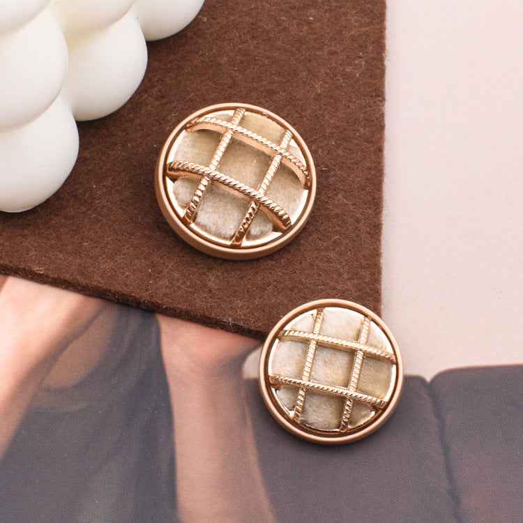 Beige fabric-covered sewing button, round with gold grid stitching