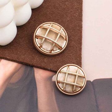 Beige fabric-covered sewing button, round with gold grid stitching