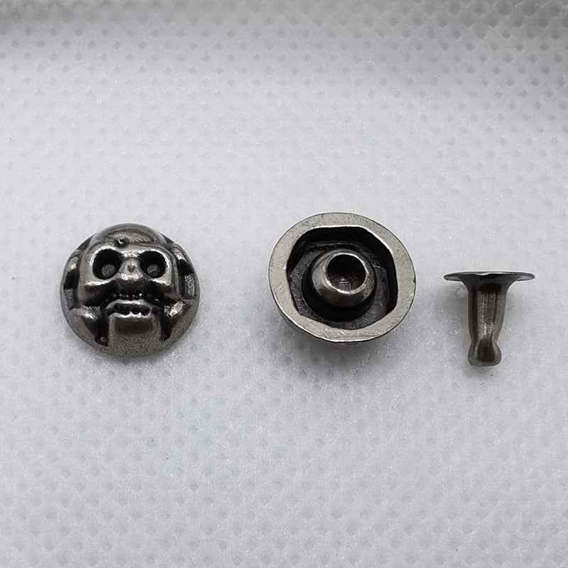 Skull rivets, silver-toned face top and back with central hole and included post