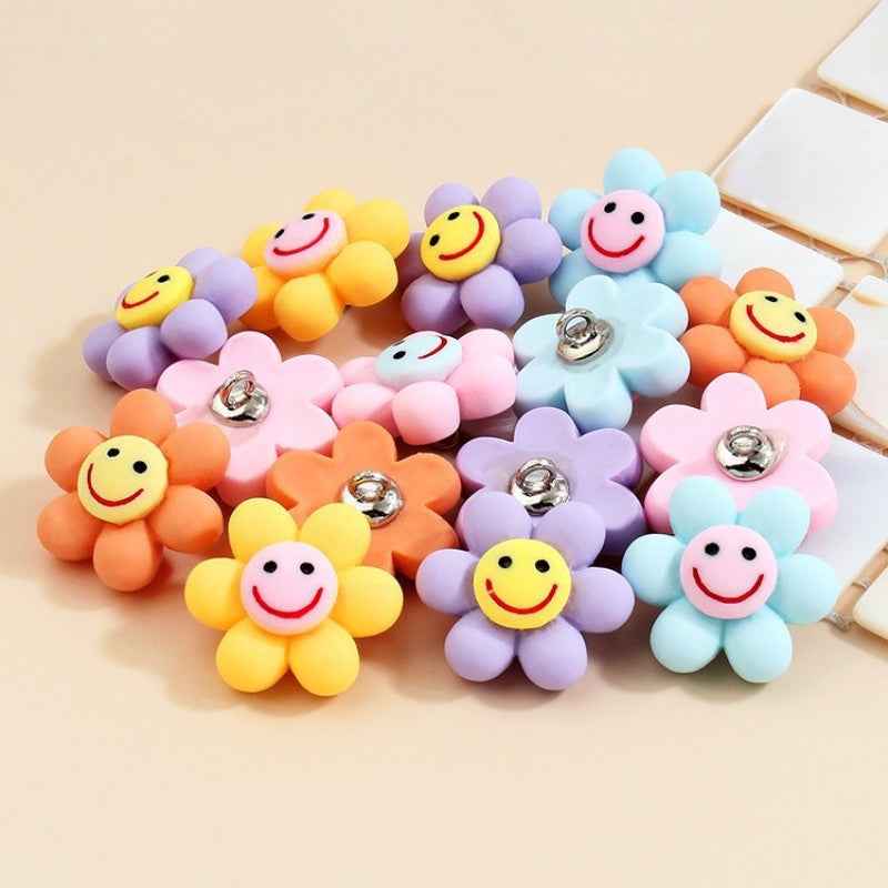 Smiley flower plastic buttons with metal shanks, orange with yellow face