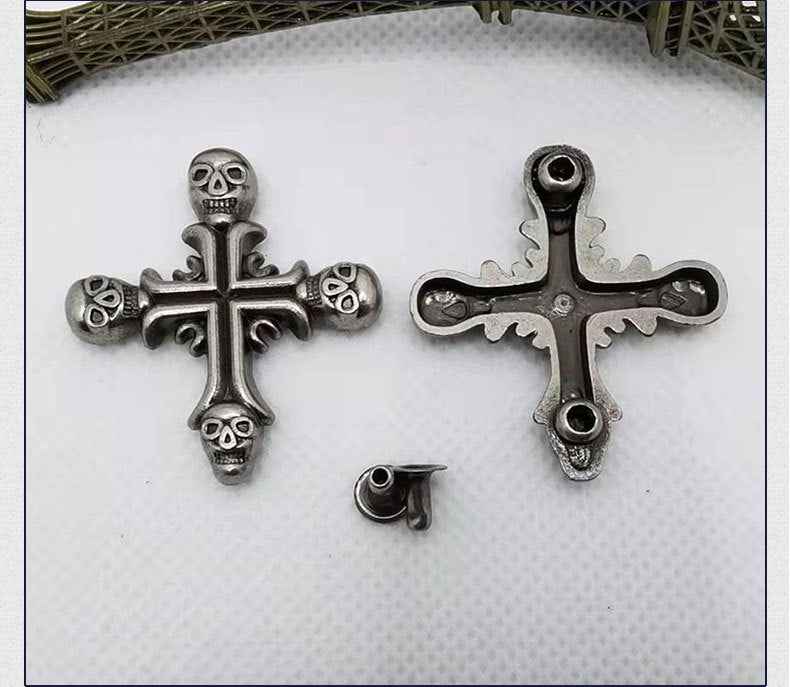 Vintage silver cross rivet studs set with skull and fleur accents, gothic punk style
