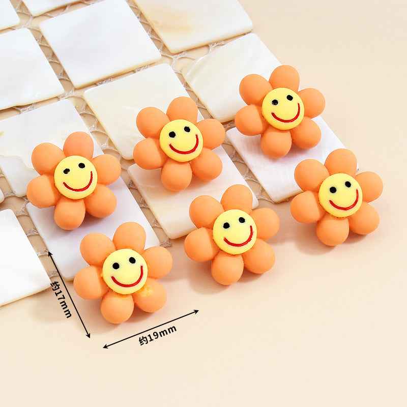 Orange smiley flower plastic buttons with metal shanks, about 19mm size