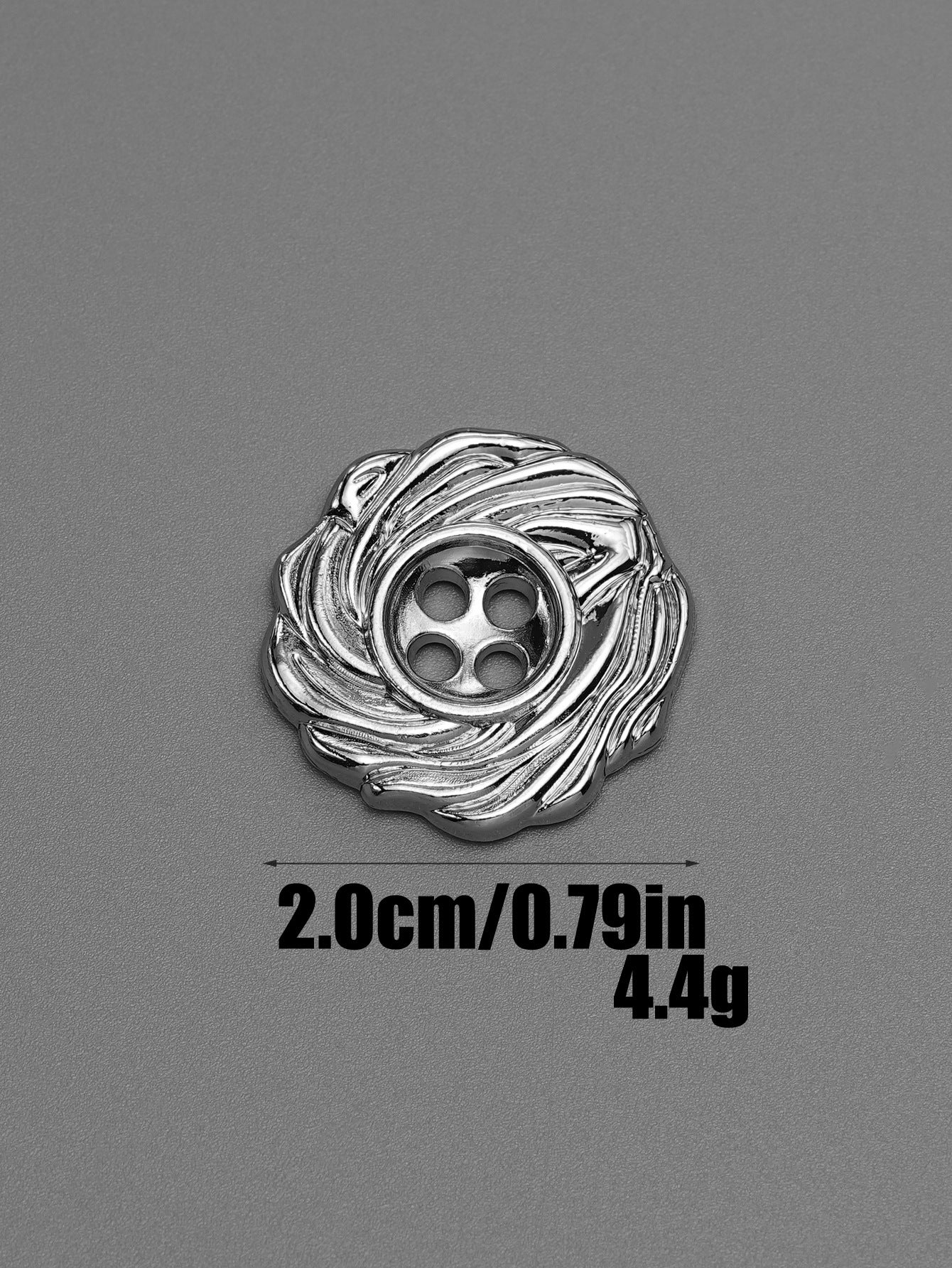 Silver 4-hole spiral metal button with textured swirl pattern, front view