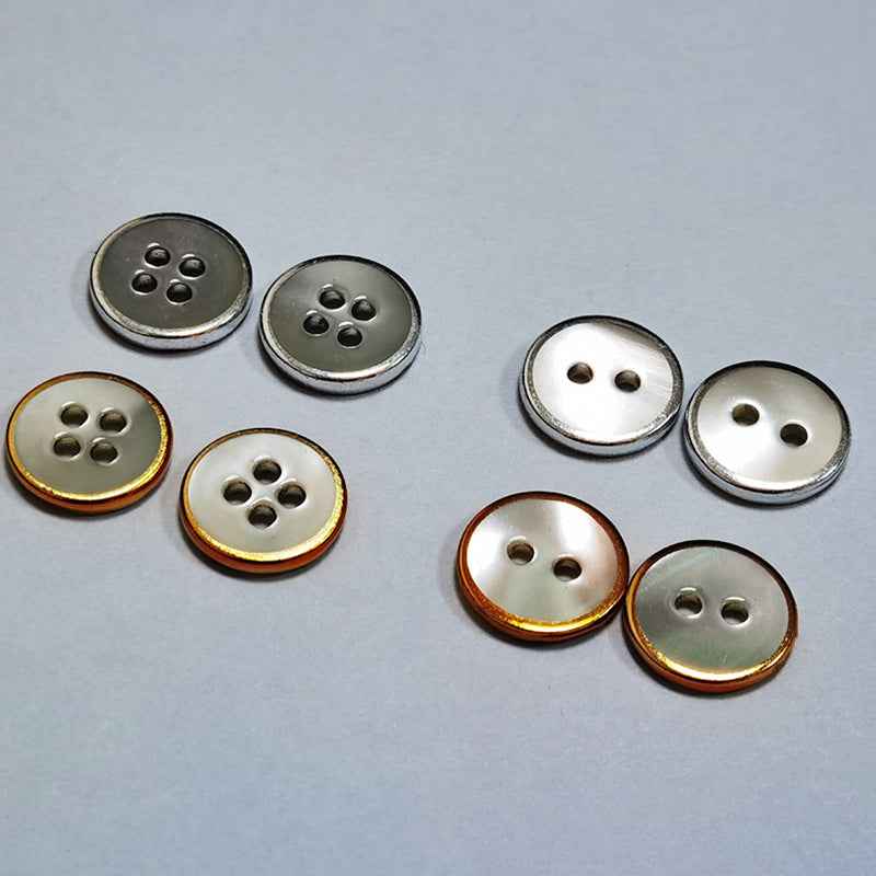 Round 2-hole shell buttons, silver-toned faces with gold/silver rim, 18L size