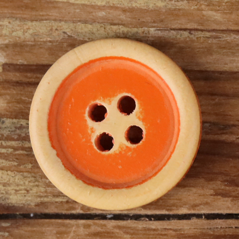 Round 4-hole wood button, orange face with light tan rim