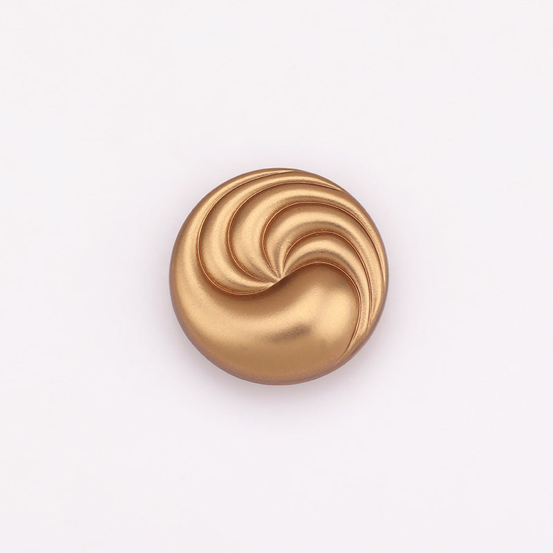 Sand gold spiral textured round metal shank button, front view with concentric swirl