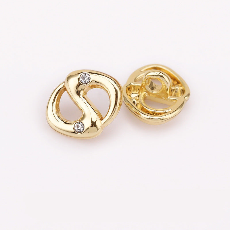 Gold pig-nose rhinestone shank button, front with clear stones and matching back