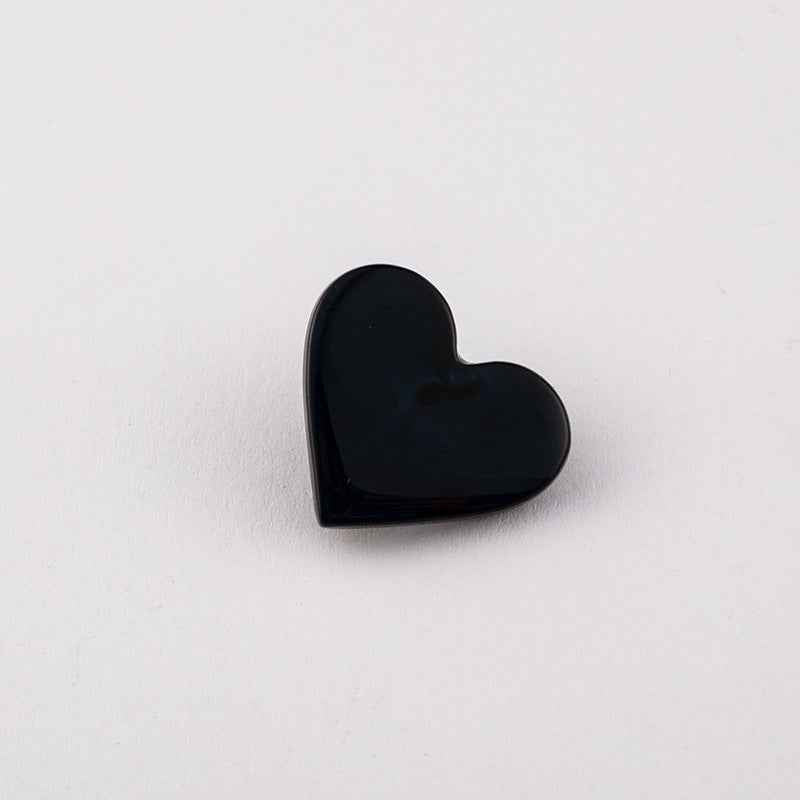 Black flat heart button with metal shank, glossy front